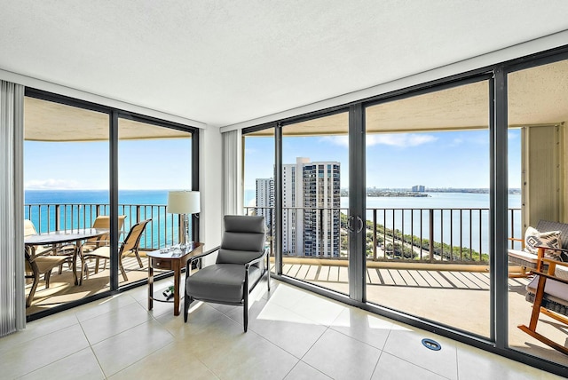 sunroom / solarium with a water view