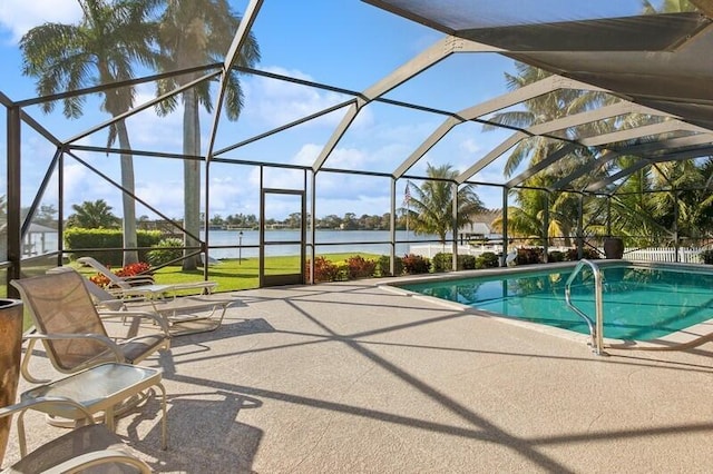 pool featuring a lanai, a water view, and a patio