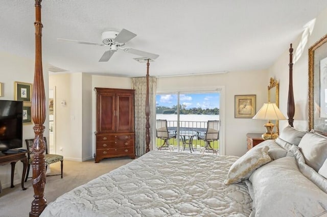 bedroom with access to exterior, visible vents, a ceiling fan, light carpet, and baseboards