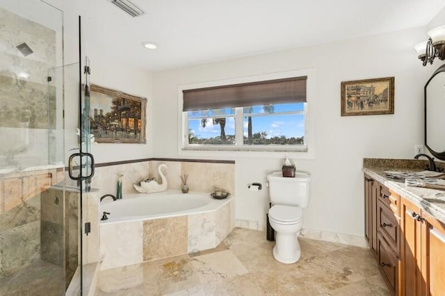 bathroom with a garden tub, vanity, visible vents, and a shower stall