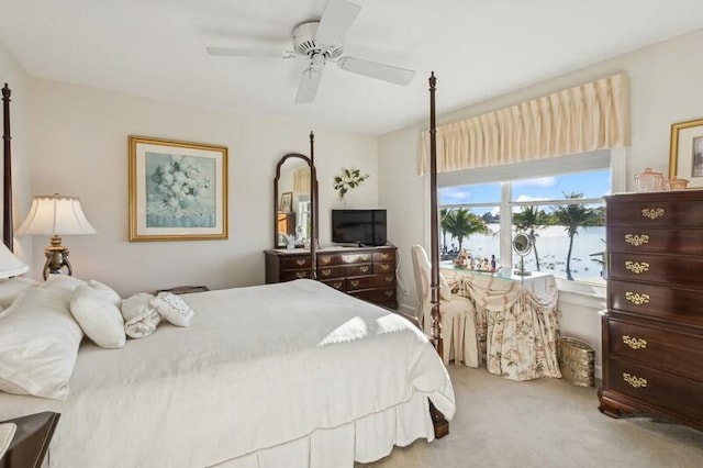 bedroom with ceiling fan and carpet floors