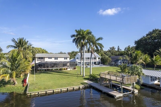 dock area with a yard and a water view