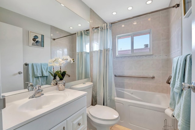 full bathroom featuring vanity, shower / bath combo with shower curtain, toilet, and recessed lighting