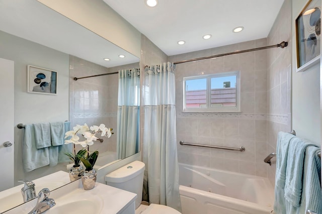 full bath with recessed lighting, shower / bath combination with curtain, toilet, and vanity
