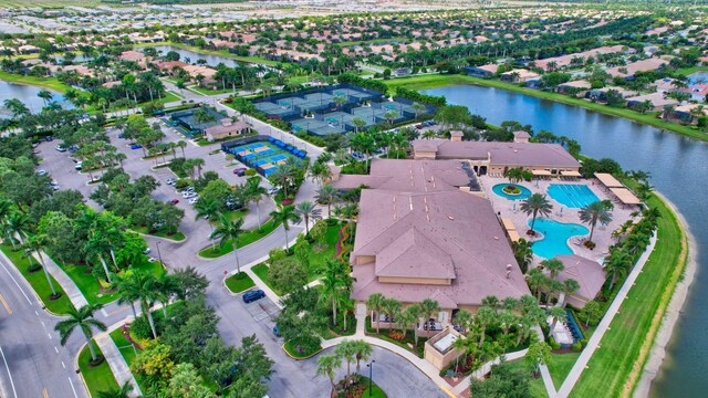 birds eye view of property with a residential view and a water view