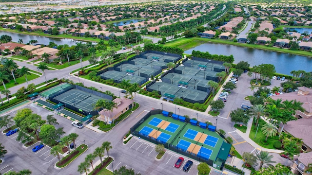 drone / aerial view with a residential view and a water view