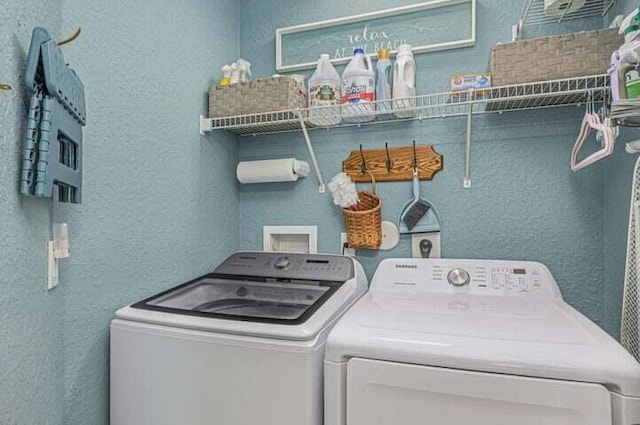 clothes washing area featuring independent washer and dryer