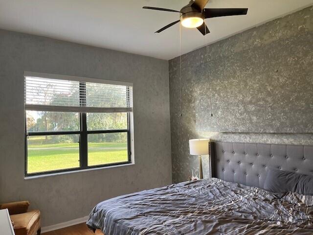 bedroom with wood-type flooring