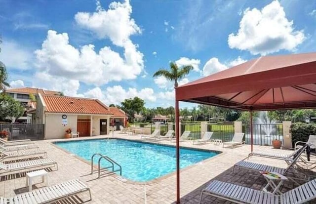 view of pool with a gazebo and a patio area