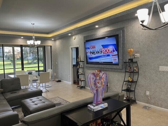 living room with an inviting chandelier