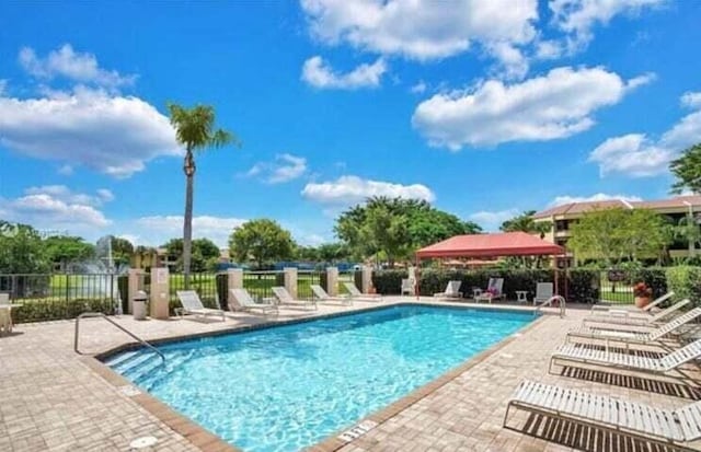 view of pool featuring a patio area