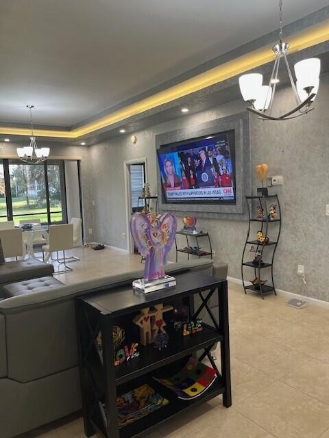 living room featuring a notable chandelier