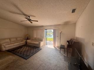 living room featuring carpet floors, a textured ceiling, and ceiling fan