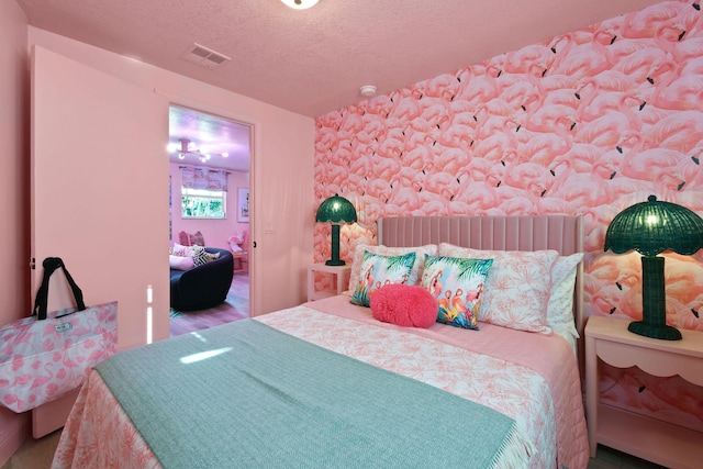 bedroom featuring a textured ceiling