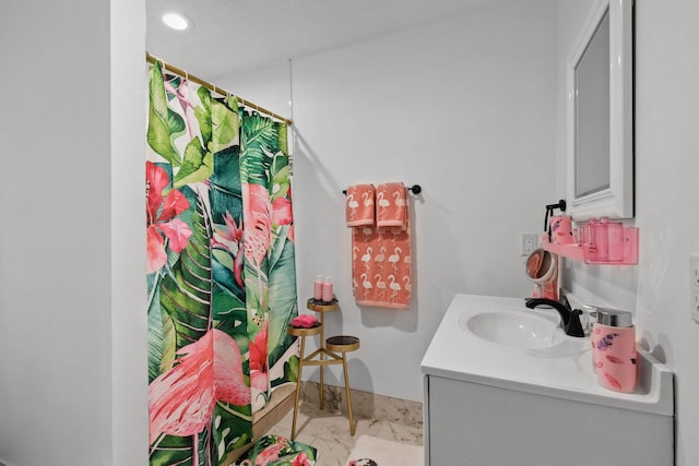 bathroom with vanity and a shower with shower curtain