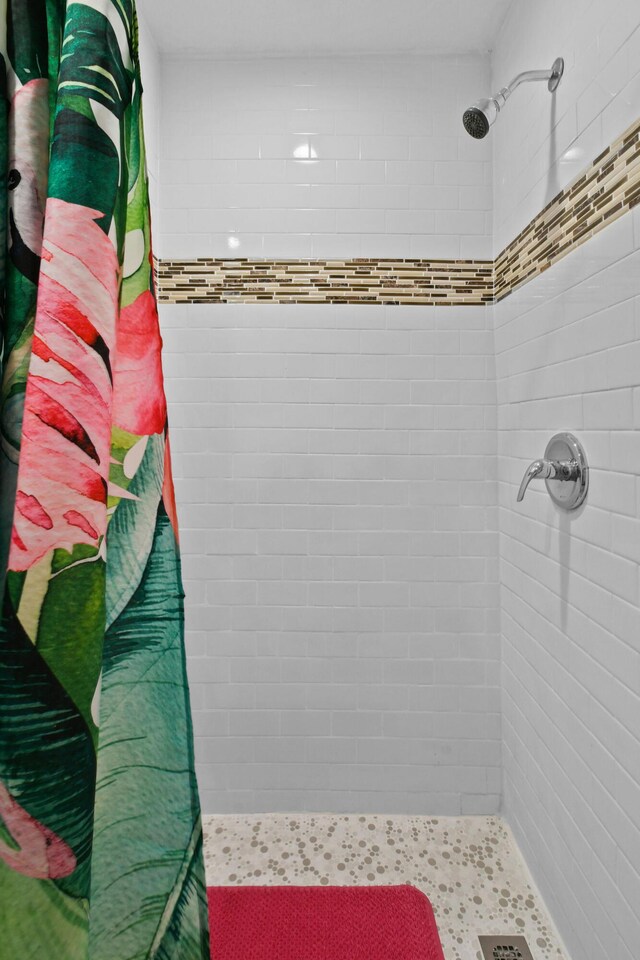 bathroom featuring a shower with curtain