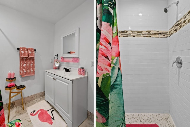 bathroom featuring vanity and a shower with shower curtain