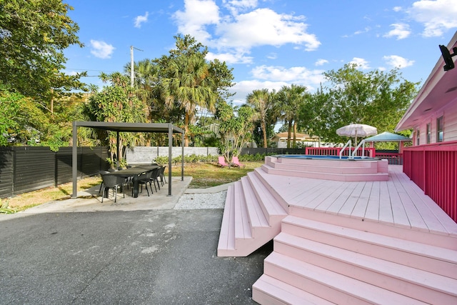 wooden terrace featuring a patio