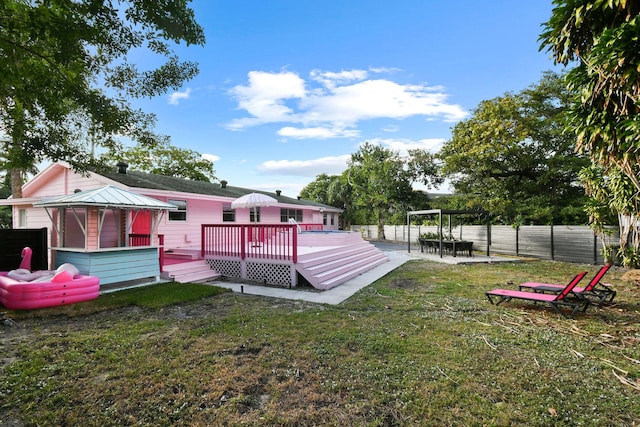 view of yard with a pergola and a deck