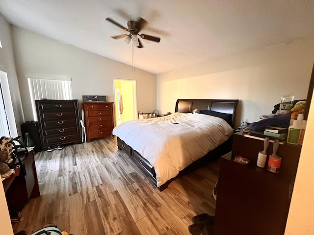 bedroom featuring lofted ceiling, hardwood / wood-style floors, and ceiling fan