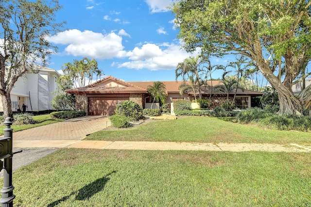 view of front facade with a garage and a front yard