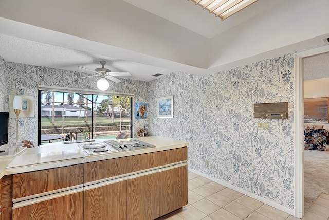 kitchen with light tile patterned floors and ceiling fan