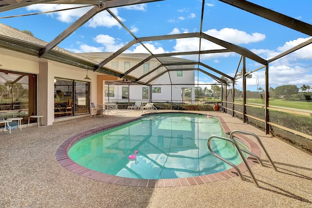 view of pool featuring a lanai and a patio