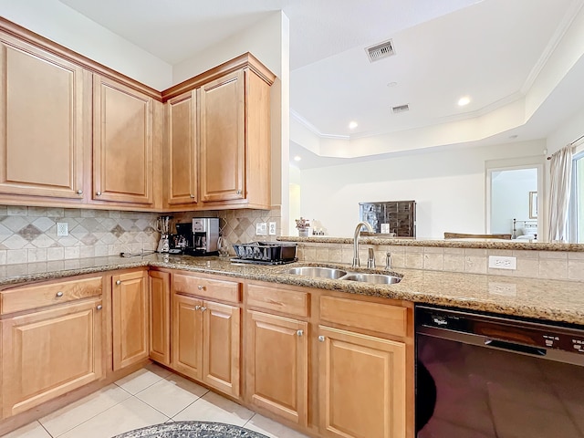 kitchen with tasteful backsplash, black dishwasher, sink, and a raised ceiling