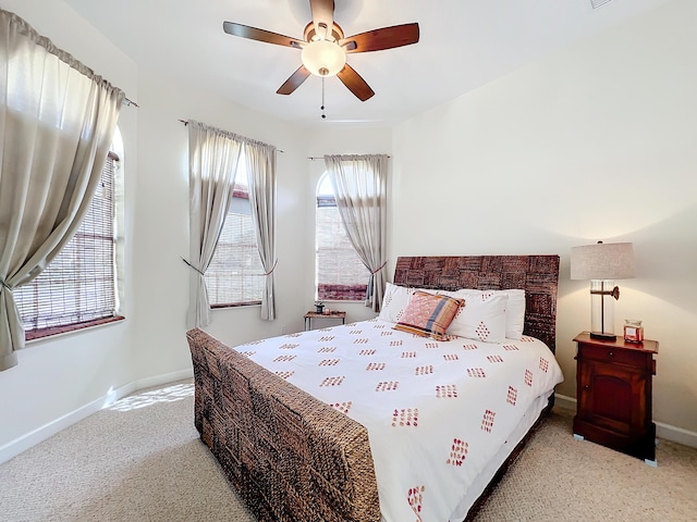 bedroom featuring ceiling fan and light colored carpet