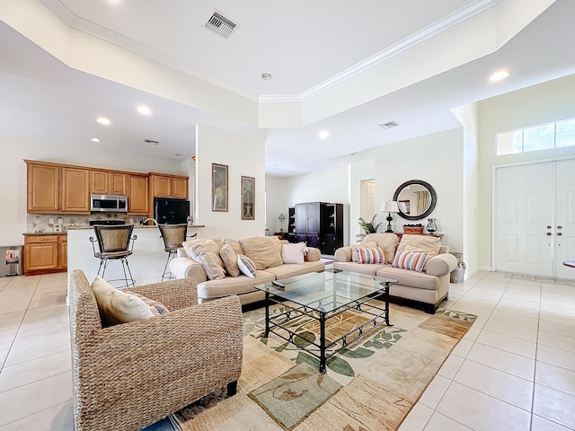 tiled living room with ornamental molding