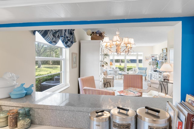 dining area featuring a notable chandelier