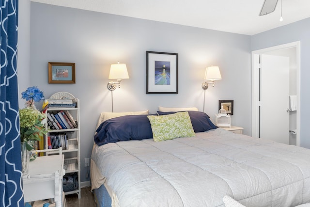 bedroom featuring hardwood / wood-style flooring and ceiling fan