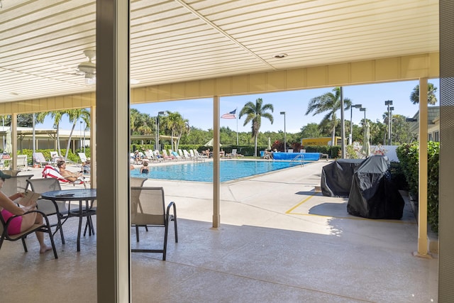 view of swimming pool with a patio