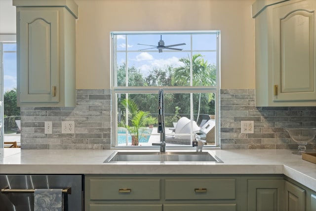 kitchen with sink, beverage cooler, ceiling fan, and decorative backsplash