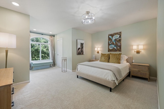 bedroom featuring light colored carpet