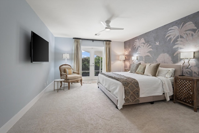 carpeted bedroom with access to exterior, ceiling fan, and french doors