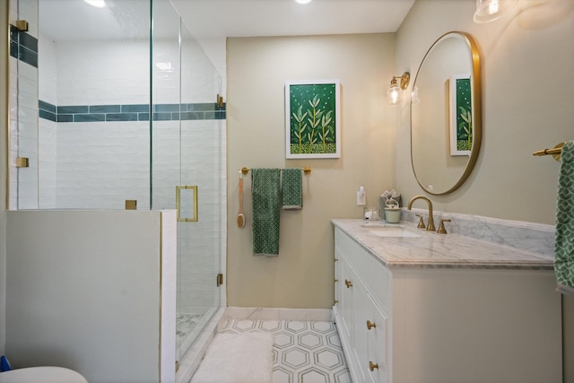 bathroom featuring vanity, tile patterned flooring, and a shower with shower door