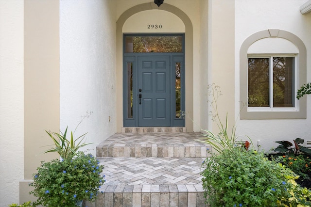 property entrance featuring a wall mounted AC