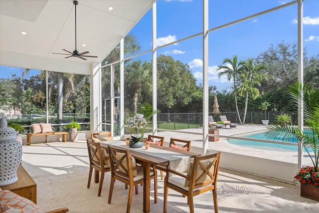 sunroom featuring a healthy amount of sunlight and ceiling fan