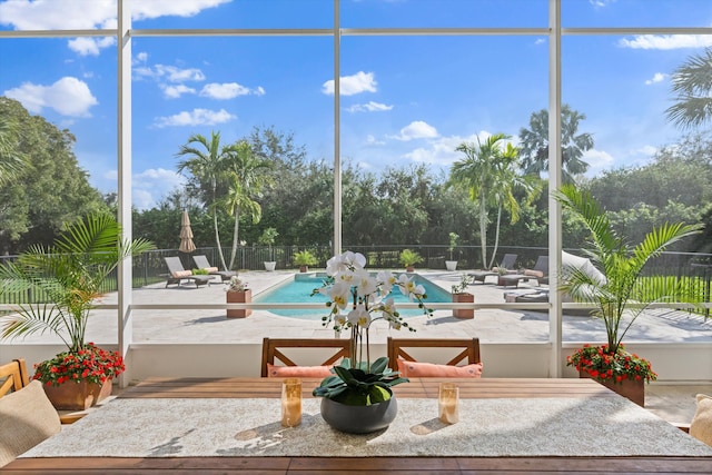 view of swimming pool with a lanai and a patio