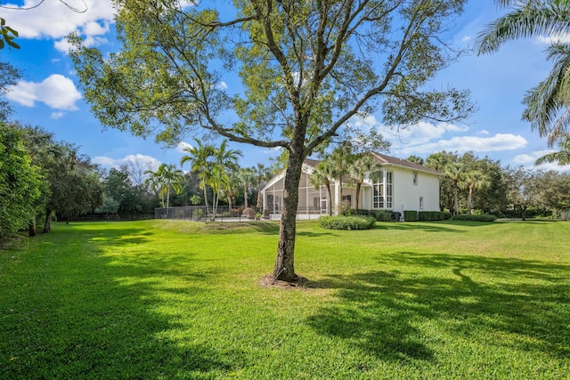 view of yard with a lanai