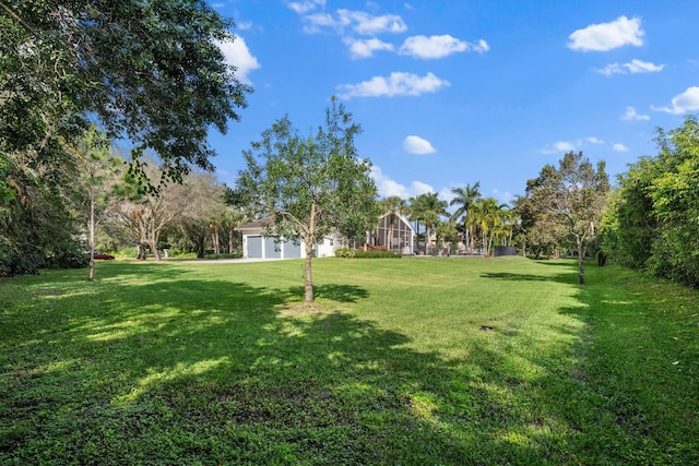 view of yard with a lanai