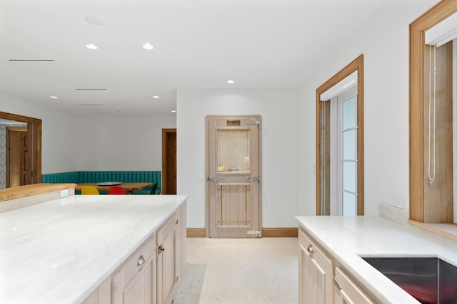 kitchen featuring light brown cabinetry