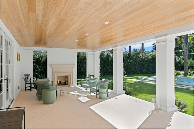 view of patio featuring exterior fireplace