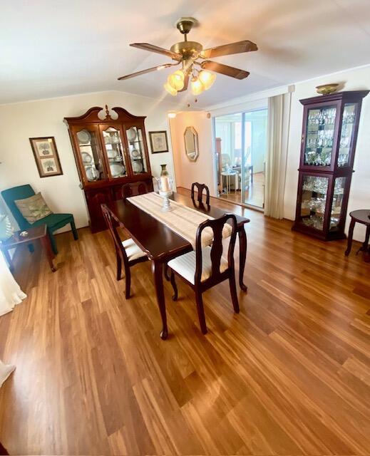 dining room with ceiling fan and hardwood / wood-style floors