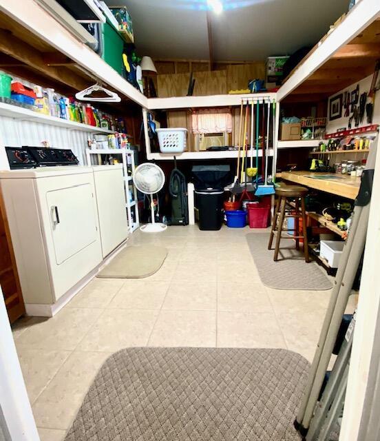 storage area featuring independent washer and dryer