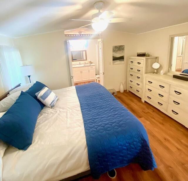 bedroom featuring light hardwood / wood-style flooring and ceiling fan