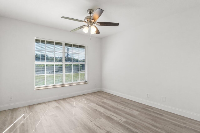 unfurnished room featuring ceiling fan and light wood-type flooring