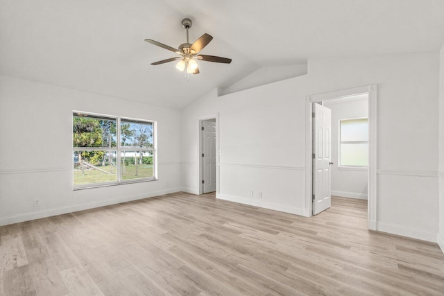 unfurnished room with lofted ceiling, light hardwood / wood-style flooring, and ceiling fan