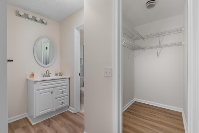 interior space with sink and light wood-type flooring